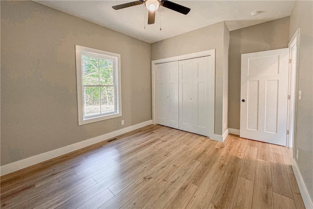 224 Simpson St, Westminster, SC 29693 - unfurnished bedroom with light wood-style flooring, a closet, and a ceiling fan
