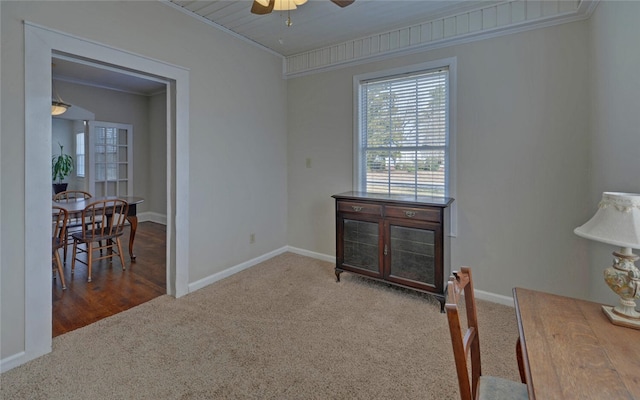 office featuring baseboards, carpet flooring, a ceiling fan, and crown molding