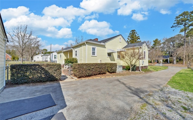 view of side of property with fence