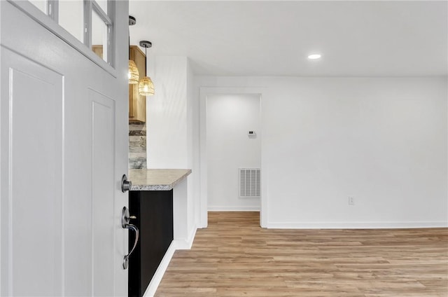 interior space with recessed lighting, visible vents, baseboards, light countertops, and light wood-type flooring