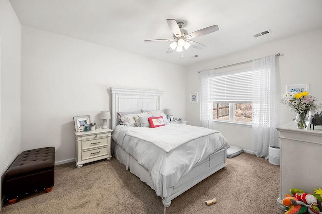 bedroom with light carpet, baseboards, visible vents, and ceiling fan