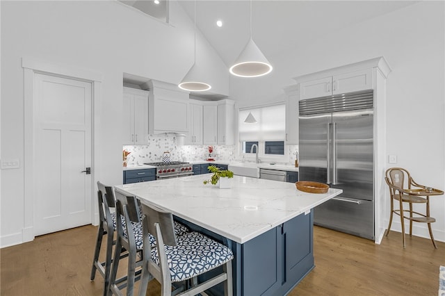1230 Melton Rd Unit 215, West Union, SC 29696 - kitchen featuring a breakfast bar, white cabinets, high end appliances, and a sink