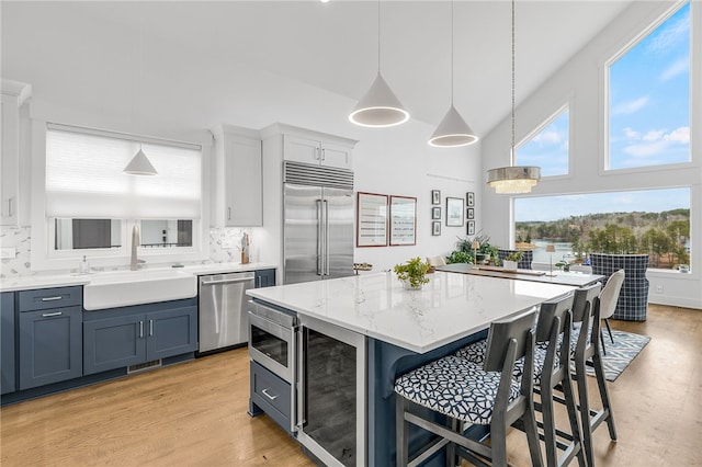 1230 Melton Rd Unit 215, West Union, SC 29696 - kitchen with a sink, built in appliances, wine cooler, a kitchen breakfast bar, and a kitchen island