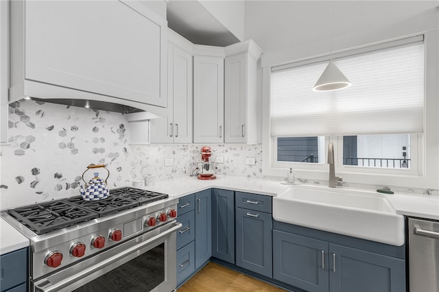 1230 Melton Rd Unit 215, West Union, SC 29696 - kitchen with light countertops, a sink, appliances with stainless steel finishes, and blue cabinetry