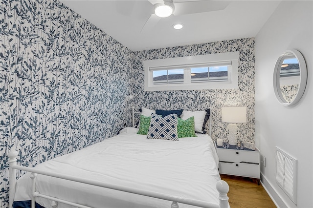 1230 Melton Rd Unit 215, West Union, SC 29696 - bedroom with baseboards, visible vents, wood finished floors, and wallpapered walls
