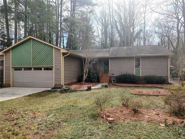 view of front facade featuring a garage, concrete driveway, and a front lawn