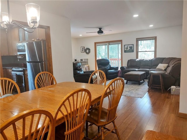 dining area with recessed lighting, wood-type flooring, and ceiling fan