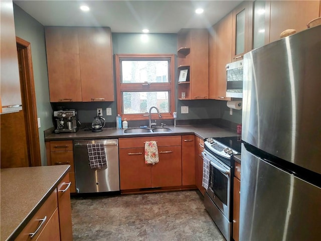 kitchen featuring recessed lighting, a sink, appliances with stainless steel finishes, open shelves, and dark countertops