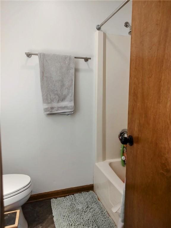 full bathroom with shower / bathtub combination, tile patterned floors, toilet, and baseboards