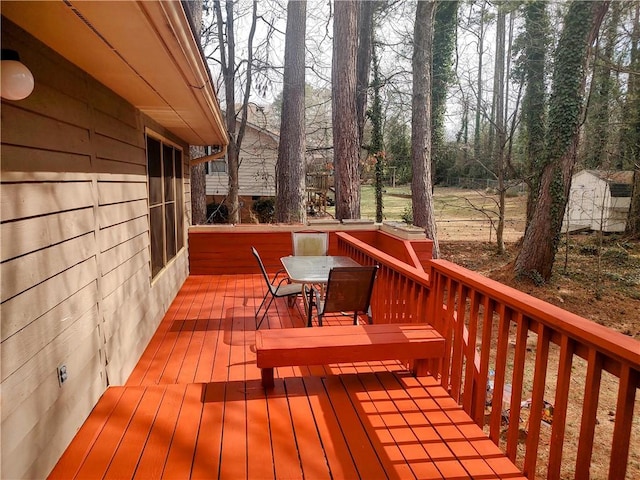 deck featuring outdoor dining area