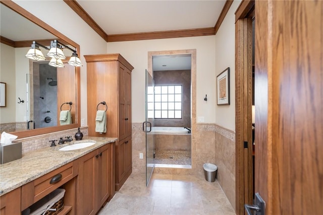 bathroom with a stall shower, ornamental molding, and vanity