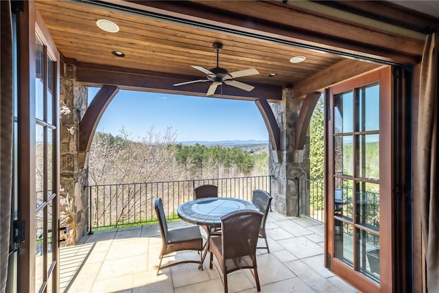 exterior space featuring ceiling fan