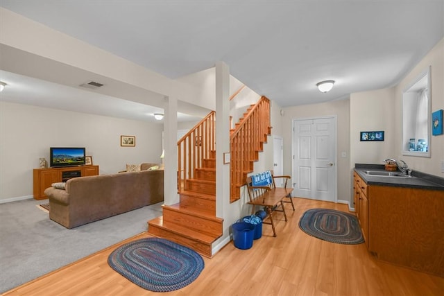 interior space with visible vents, baseboards, and wood finished floors