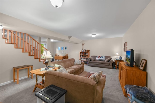 living room featuring light carpet, stairway, and baseboards