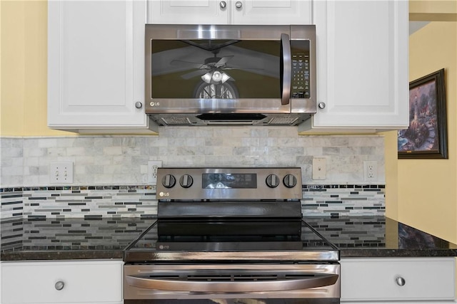 kitchen with appliances with stainless steel finishes, white cabinetry, ceiling fan, and tasteful backsplash