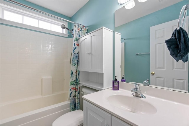 bathroom featuring shower / bath combo, vanity, and toilet