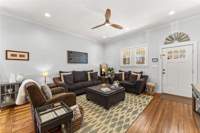 living area featuring ornamental molding, recessed lighting, and wood-type flooring