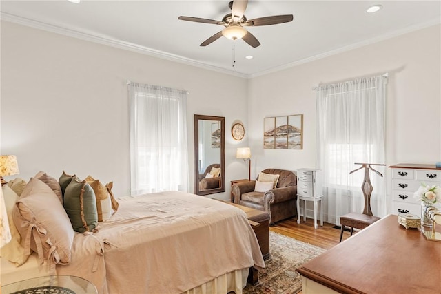 bedroom featuring recessed lighting, wood finished floors, a ceiling fan, and crown molding