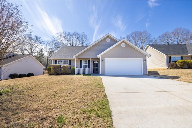 ranch-style house featuring an attached garage, driveway, a porch, and a front yard