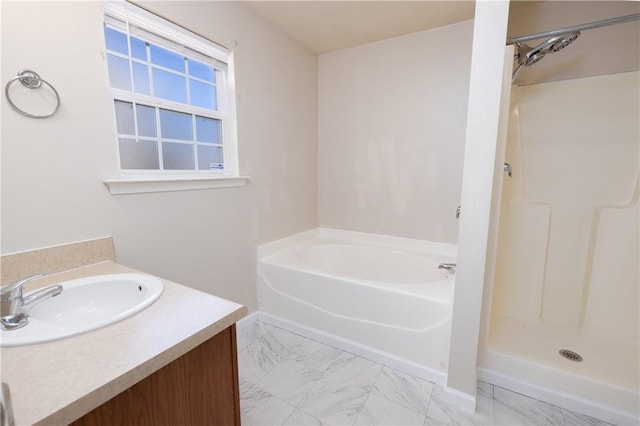 bathroom featuring marble finish floor, a shower stall, vanity, and a bath