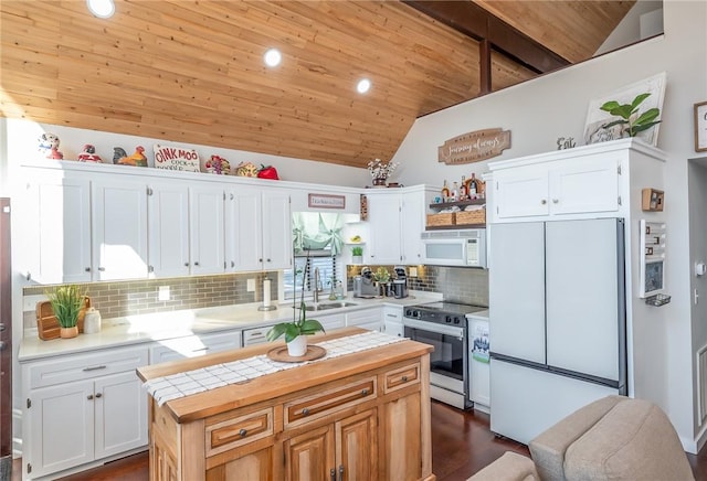 kitchen with white appliances, a sink, wood counters, wood ceiling, and white cabinets