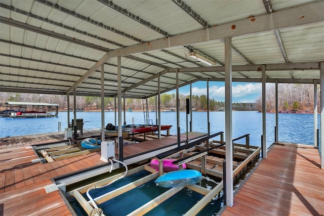 dock area with a water view and boat lift