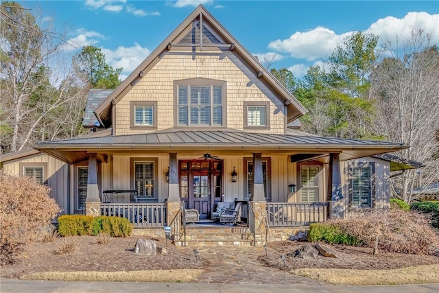 view of front of property featuring a standing seam roof, metal roof, covered porch, and board and batten siding