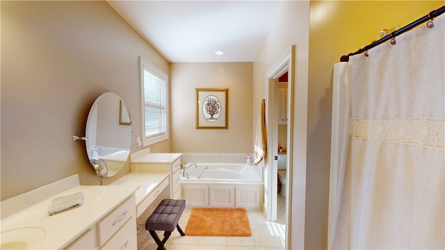 bathroom with tile patterned flooring, a garden tub, vanity, and toilet