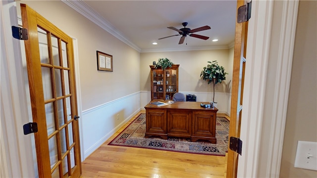 office space featuring a wainscoted wall, ornamental molding, wood finished floors, and recessed lighting