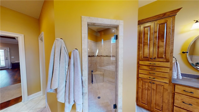 full bathroom featuring baseboards, a shower stall, vanity, and tile patterned floors