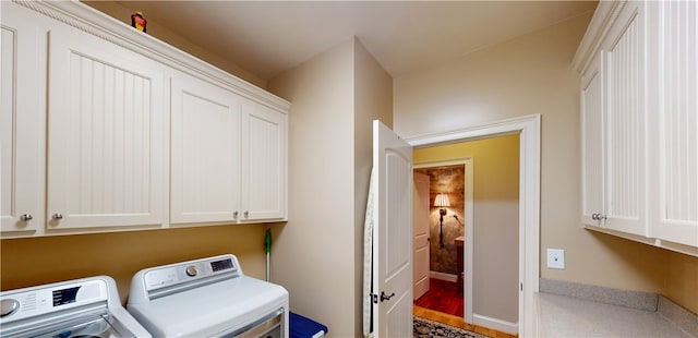 laundry area featuring cabinet space and washer and clothes dryer