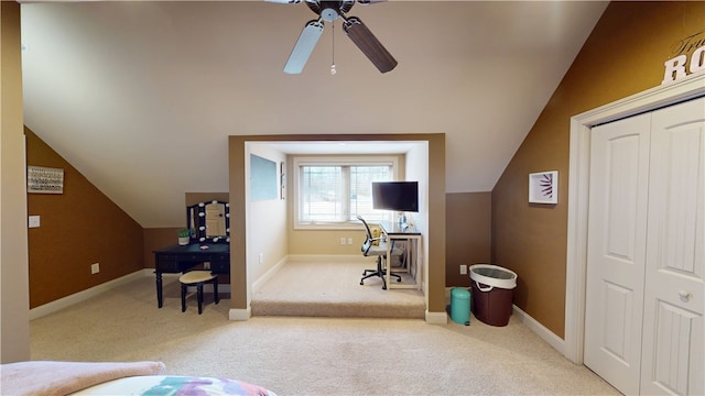 interior space with carpet floors, baseboards, and vaulted ceiling