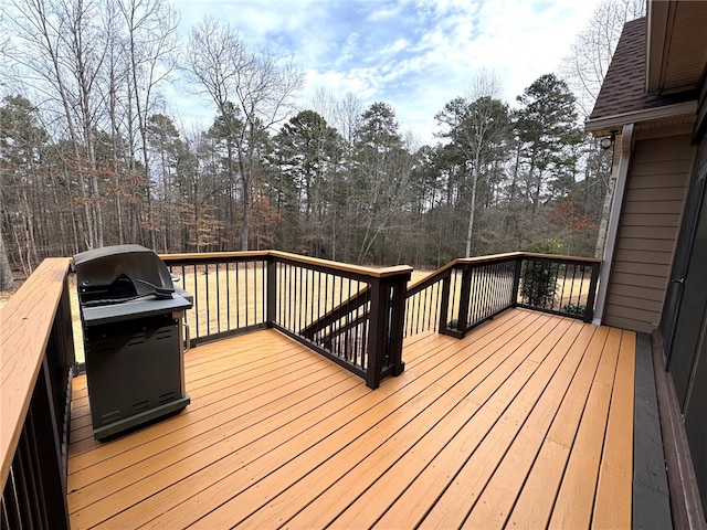 wooden deck featuring area for grilling