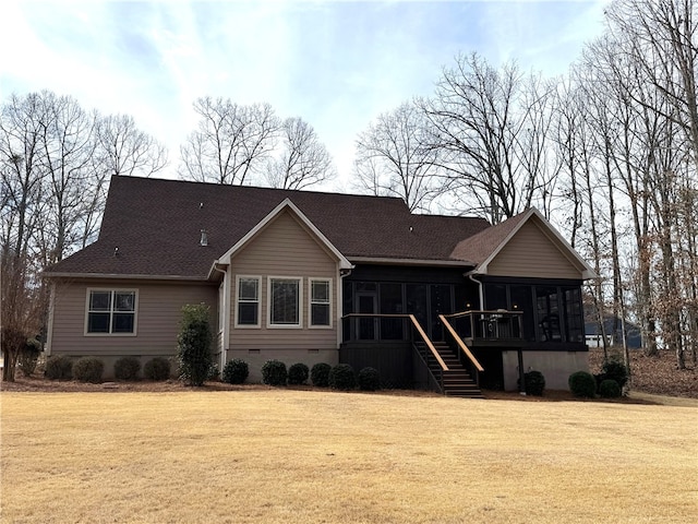 rear view of property featuring stairs, a lawn, crawl space, and a sunroom