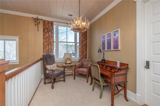 sitting room featuring a chandelier, a wealth of natural light, wooden ceiling, and visible vents