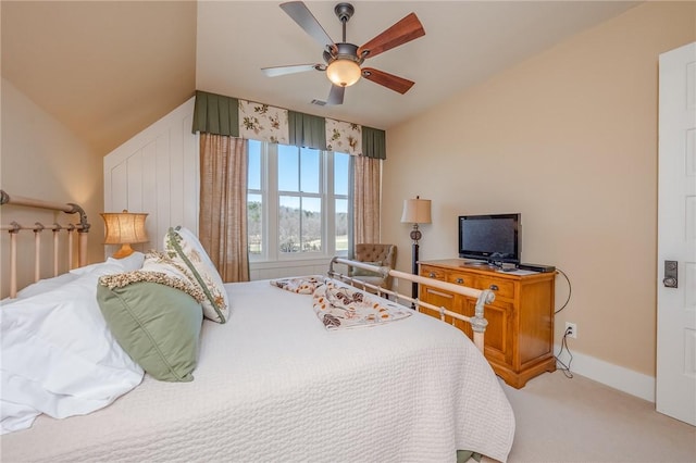 bedroom featuring visible vents, a ceiling fan, carpet flooring, vaulted ceiling, and baseboards