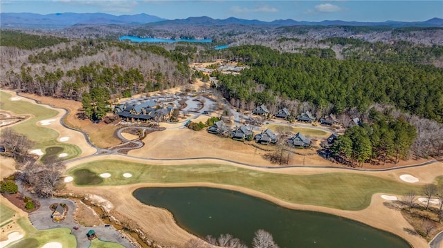 bird's eye view with a mountain view, a forest view, and golf course view