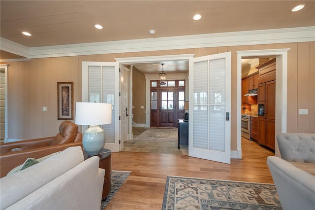 living area featuring recessed lighting and light wood-style flooring