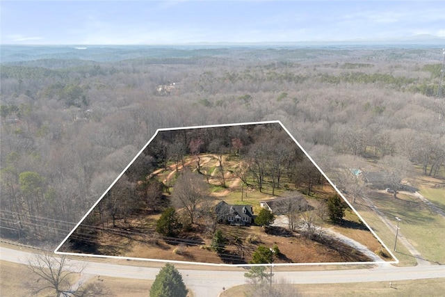 aerial view with a rural view and a wooded view