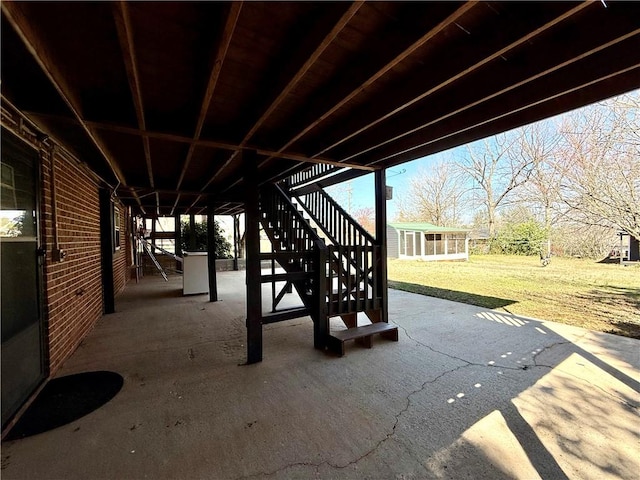 view of patio / terrace with an outdoor structure and stairs