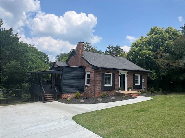 1003 S Walnut St, Seneca, SC 29678 - view of front facade featuring a front lawn, a chimney, and brick siding