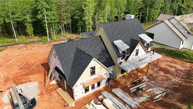 view of subject property featuring a forest