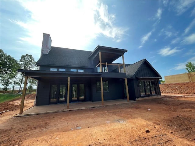 248 W Old Pendleton Rd, Central, SC 29630 - rear view of house with a balcony, a patio area, a chimney, and roof with shingles