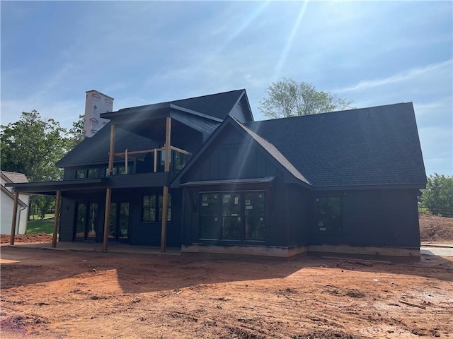 248 W Old Pendleton Rd, Central, SC 29630 - back of house featuring board and batten siding, a chimney, french doors, and roof with shingles
