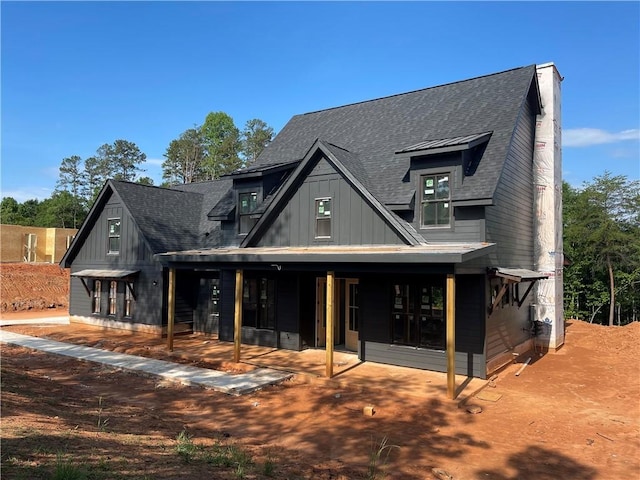 248 W Old Pendleton Rd, Central, SC 29630 - view of front of home with board and batten siding, a patio, and roof with shingles