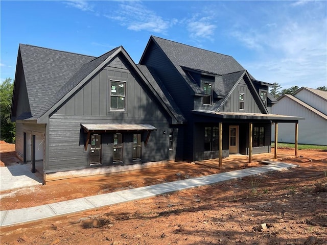 248 W Old Pendleton Rd, Central, SC 29630 - back of house featuring a shingled roof, board and batten siding, and covered porch