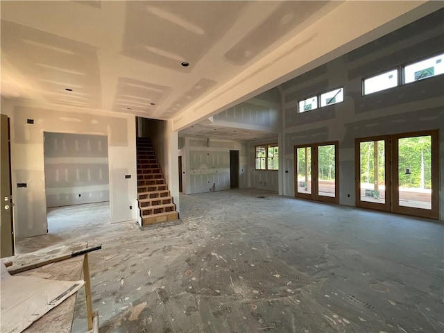 248 W Old Pendleton Rd, Central, SC 29630 - unfurnished living room featuring stairs, french doors, and a high ceiling