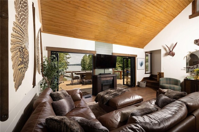 living area with wooden ceiling, high vaulted ceiling, and wood finished floors