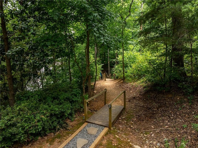 view of property's community featuring a forest view