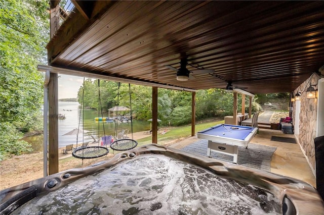 view of patio featuring a ceiling fan and a hot tub